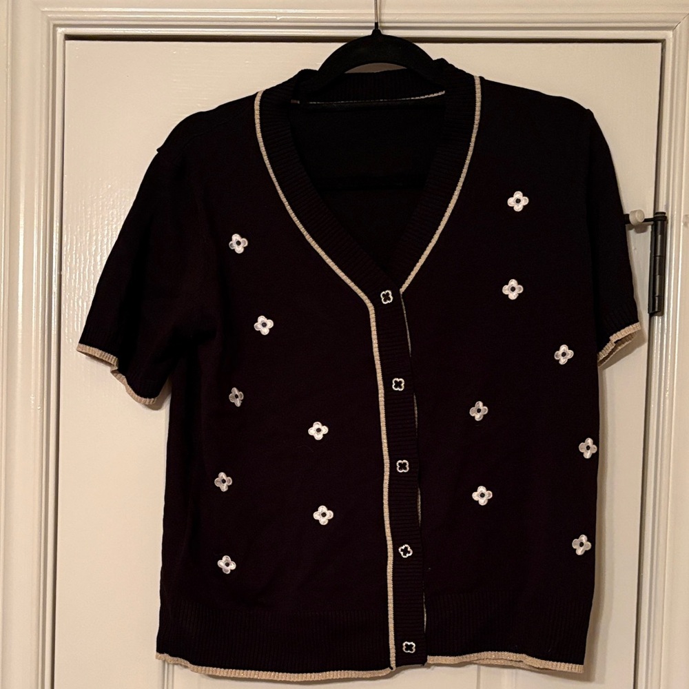 Black Cardigan with White Floral Accents